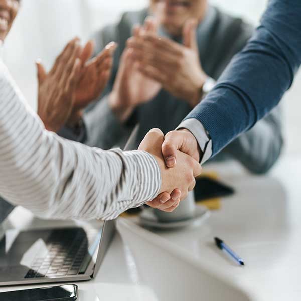 Colleagues shaking hands with each other